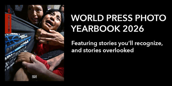 Advertisement for World Press Photo Yearbook 2026 with a photo of a person holding a child, text overlay on a black background.