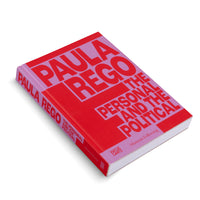 Ein Buch mit dem Titel Paula Rego: The Personal and the Political liegt schräg auf einer weißen Oberfläche. Das Cover ist in kräftigem Rot und Lila gehalten, mit dem Titel in großer, blockartiger Schrift.